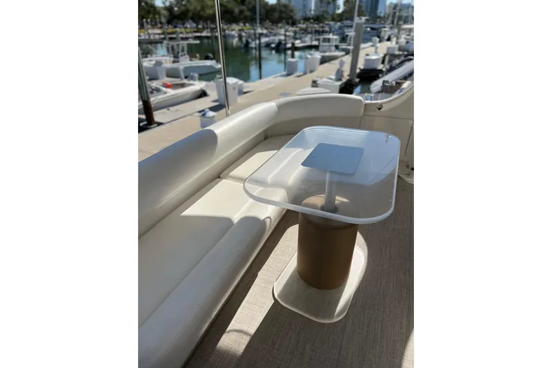 Bula Bula Yacht Photos Pics Luxurious seating area on a 2006 Sea Ray 40 Motor Yacht, docked at a marina.