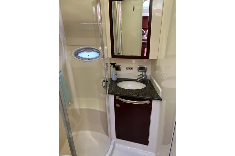 Bula Bula Yacht Photos Pics 2006 Sea Ray 40 Motor Yacht bathroom with sink, mirror, and shower.
