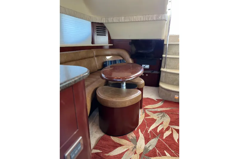 Bula Bula Yacht Photos Pics Luxurious interior of 2006 Sea Ray 40 Motor Yacht with leather seating and elegant table.