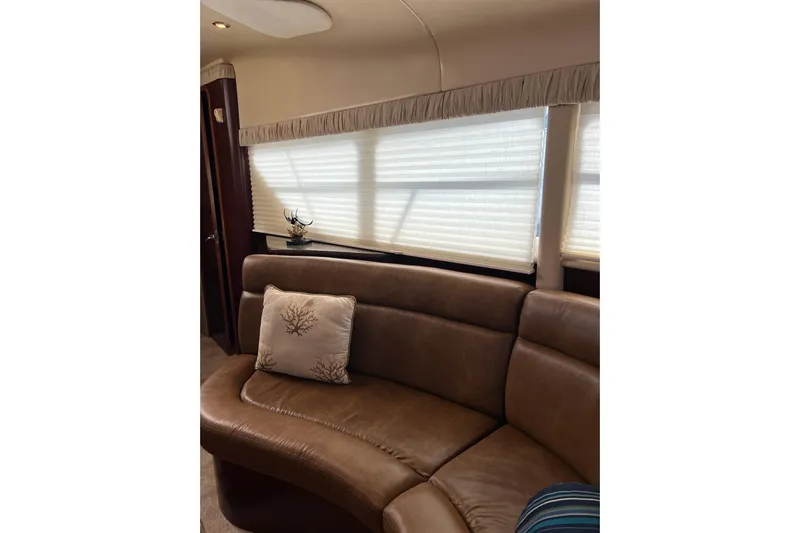 Bula Bula Yacht Photos Pics Luxurious interior of 2006 Sea Ray 40 Motor Yacht with leather seating and decorative pillow.