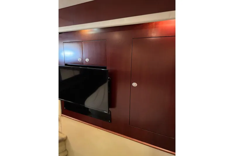 Bula Bula Yacht Photos Pics Interior of 2006 Sea Ray 40 Motor Yacht with mounted TV and wooden cabinets.