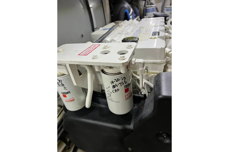 Bula Bula Yacht Photos Pics Engine compartment of a 2006 Sea Ray 40 Motor Yacht, featuring fuel filters and engine components.