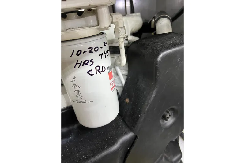 Bula Bula Yacht Photos Pics Engine component of 2006 Sea Ray 40 Motor Yacht with filter and handwritten notes.