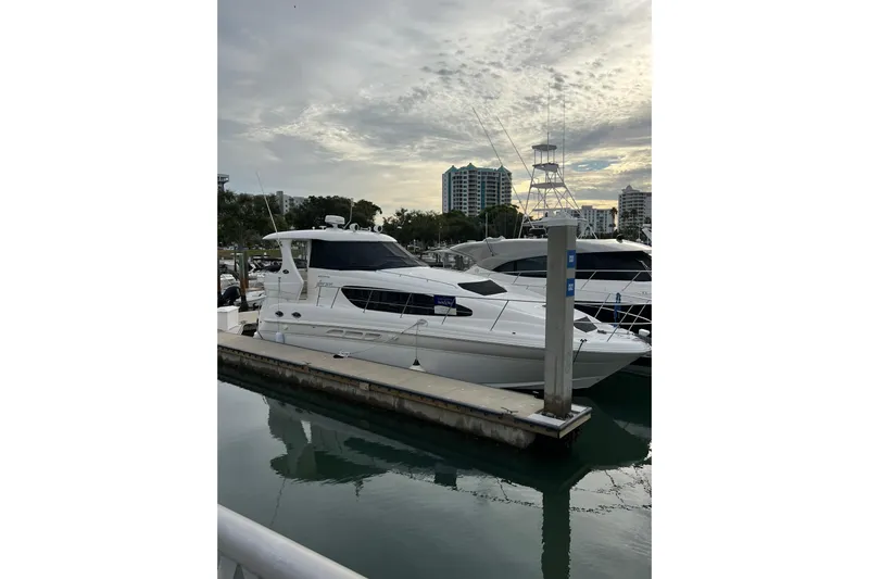 Bula Bula Yacht Photos Pics 2006 Sea Ray 40 Motor Yacht docked at marina under cloudy sky.