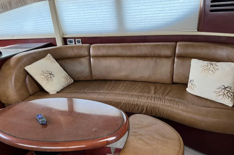 Bula Bula Yacht Photos Pics Luxurious interior of 2006 Sea Ray 40 Motor Yacht with leather seating and decorative pillows.