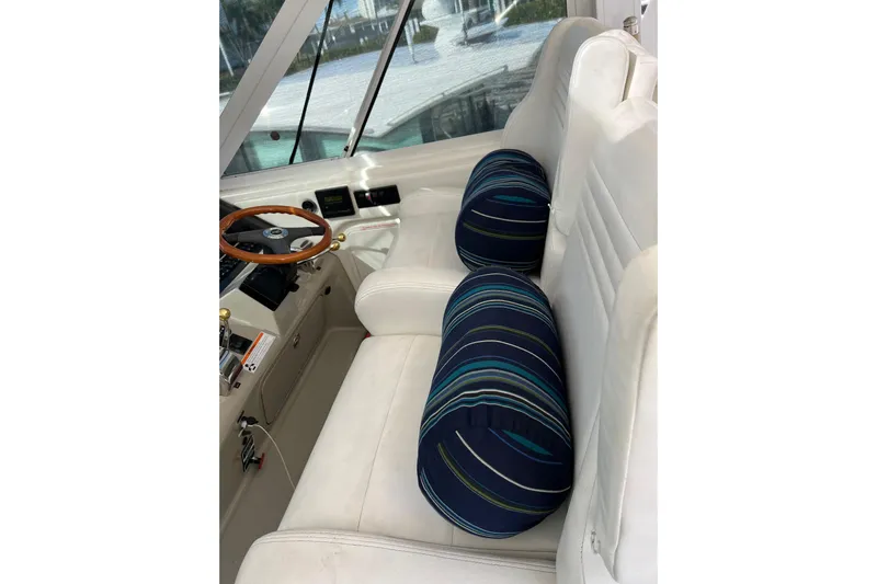 Bula Bula Yacht Photos Pics Interior of 2006 Sea Ray 40 Motor Yacht with striped cushions and steering wheel.