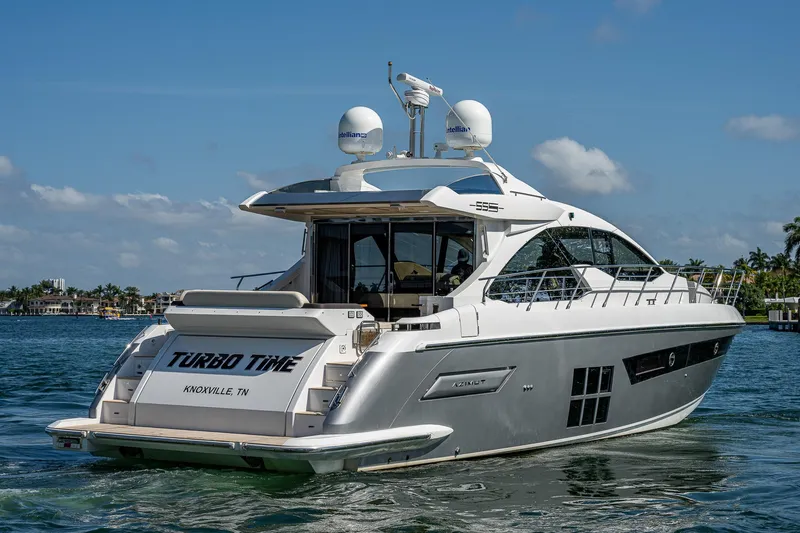  Yacht Photos Pics 2014 Azimut 55S yacht on water, rear view, clear sky background.