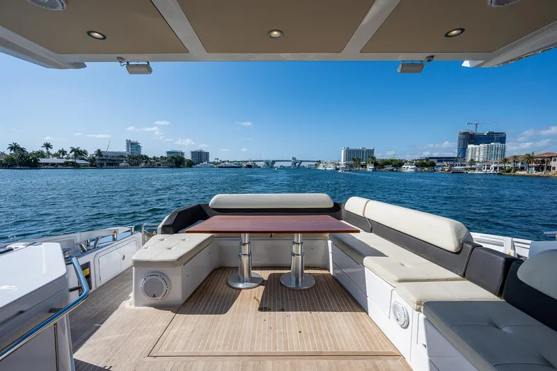  Yacht Photos Pics Luxury Azimut 55S yacht deck with seating, table, and scenic waterfront view, 2014 model.