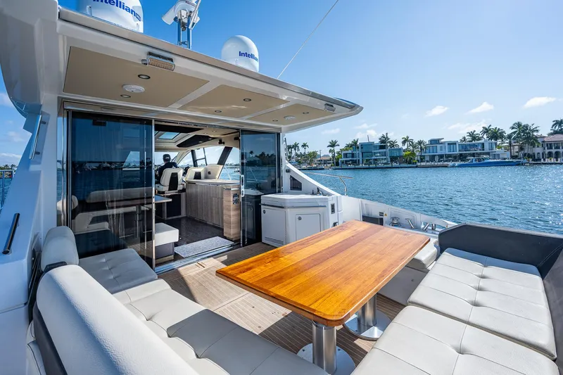  Yacht Photos Pics Luxurious 2014 Azimut 55S yacht with spacious outdoor seating and scenic waterfront view.