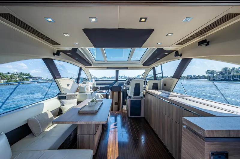  Yacht Photos Pics Luxurious interior of a 2014 Azimut 55S yacht with panoramic windows and elegant furnishings.