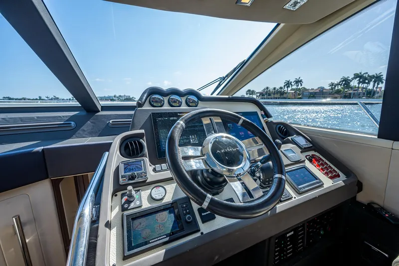 Yacht Photos Pics Cockpit of 2014 Azimut 55S yacht with modern navigation controls and steering wheel.