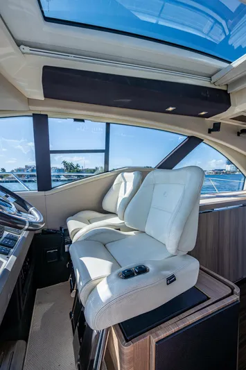  Yacht Photos Pics Luxurious interior of a 2014 Azimut 55S yacht with plush seating and panoramic windows.