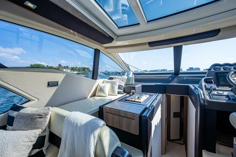  Yacht Photos Pics Luxurious interior of a 2014 Azimut 55S yacht with panoramic windows and elegant seating.