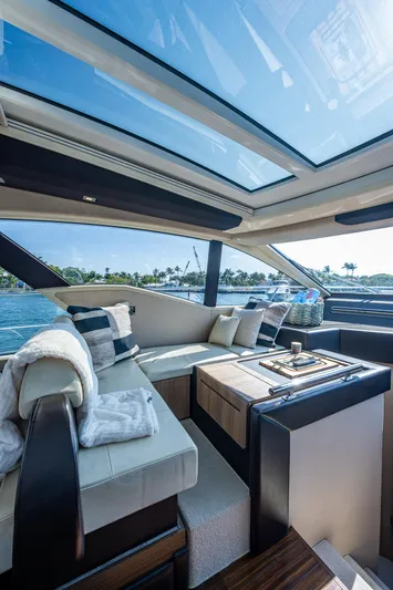 Yacht Photos Pics Luxurious interior of a 2014 Azimut 55S yacht with panoramic windows and elegant seating.