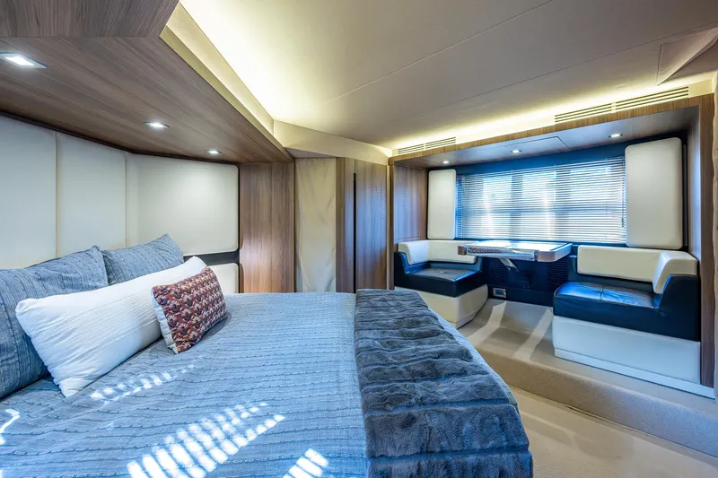  Yacht Photos Pics Luxurious interior of a 2014 Azimut 55S yacht with elegant bedroom and seating area.