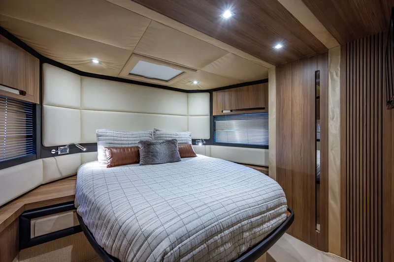  Yacht Photos Pics Luxurious bedroom interior of 2014 Azimut 55S yacht with modern design and cozy bedding.