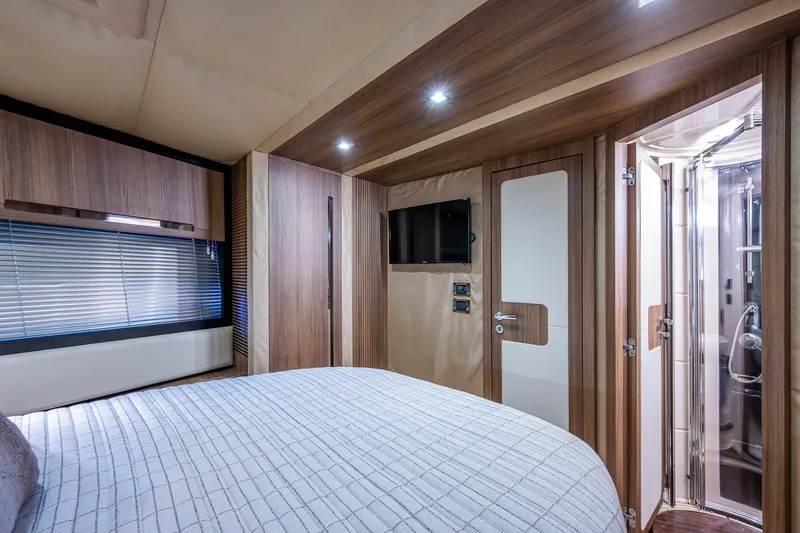  Yacht Photos Pics Luxurious interior of 2014 Azimut 55S yacht with modern bedroom and ensuite bathroom.