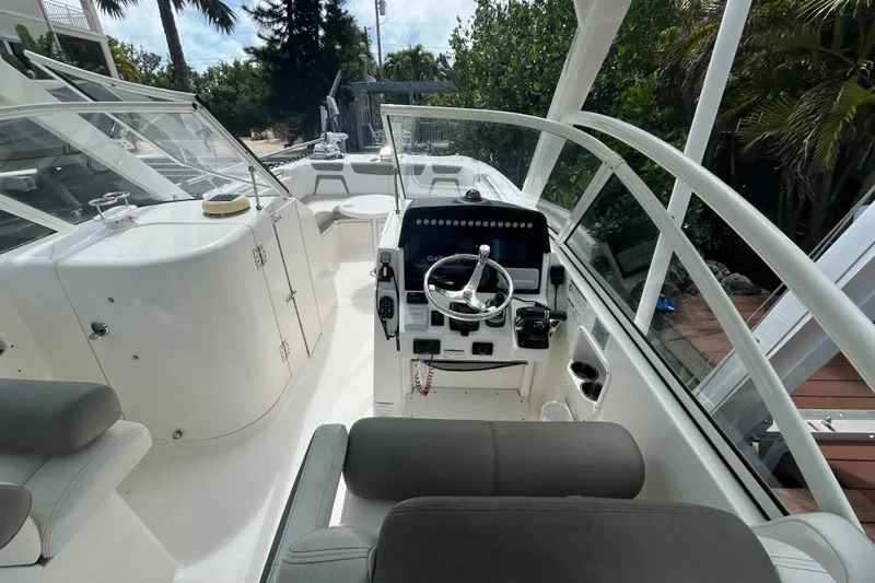  Yacht Photos Pics 2020 World Cat 296 DC boat interior with steering console and seating.