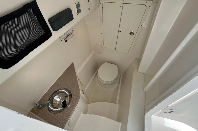  Yacht Photos Pics 2020 World Cat 296 DC boat interior with sink and toilet.
