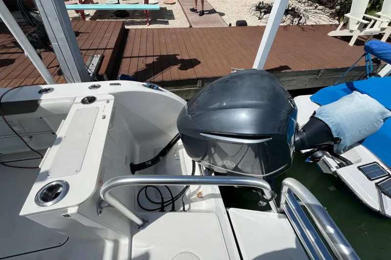  Yacht Photos Pics 2020 World Cat 296 DC boat with Yamaha outboard motor, docked near wooden deck.