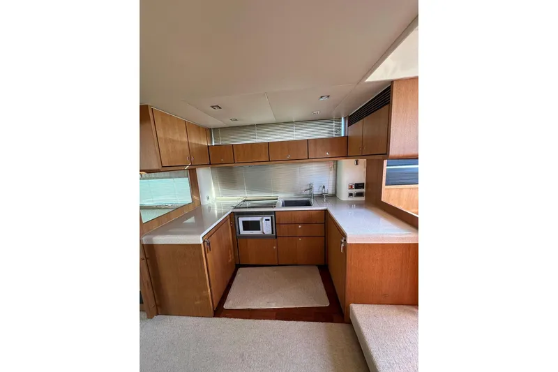  Yacht Photos Pics Luxurious kitchen interior of 2014 Fairline Squadron 65 yacht with modern amenities.