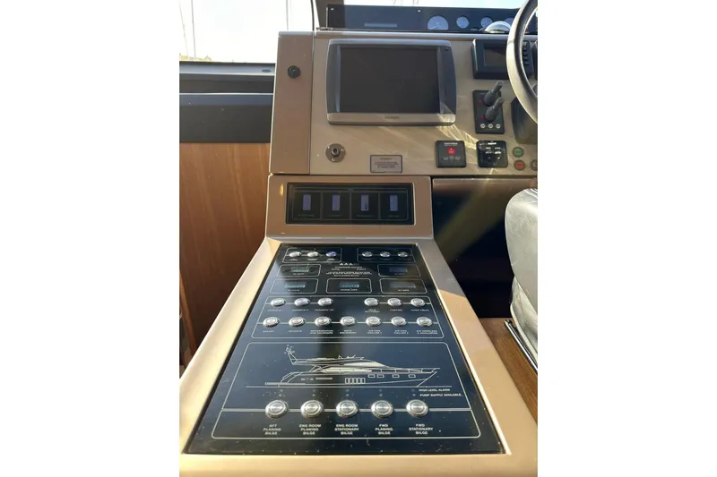  Yacht Photos Pics Control panel of 2014 Fairline Squadron 65 yacht with navigation and system controls.