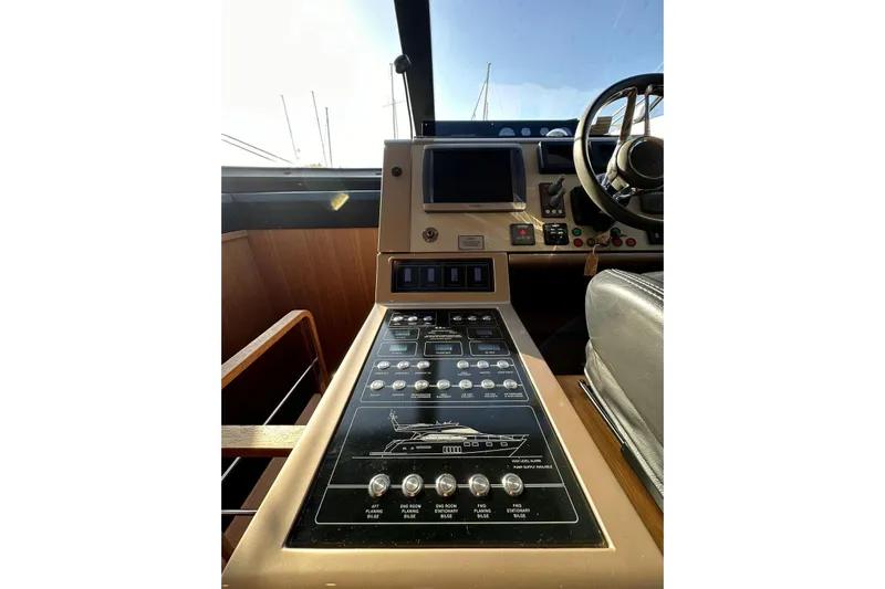  Yacht Photos Pics Control panel of 2014 Fairline Squadron 65 yacht, featuring navigation and steering equipment.