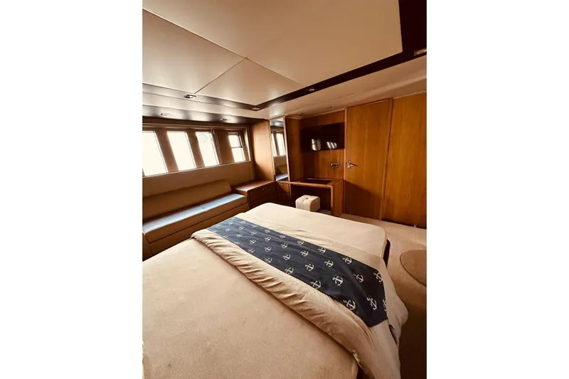  Yacht Photos Pics Luxurious cabin interior of 2014 Fairline Squadron 65 yacht with elegant wood finishes.