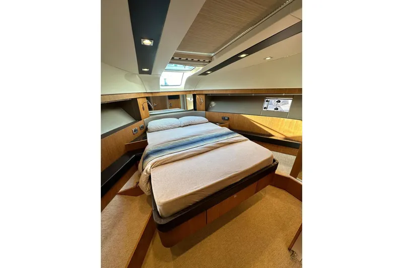  Yacht Photos Pics Luxurious cabin interior of 2014 Fairline Squadron 65 yacht with elegant bedding.