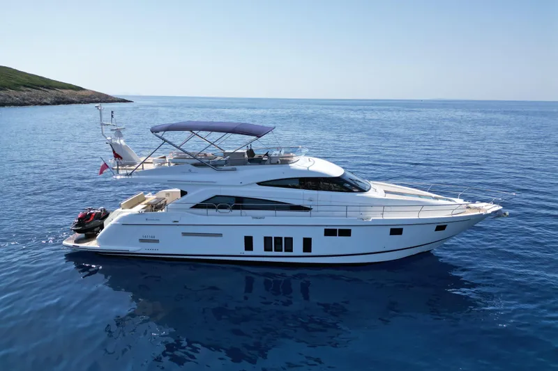  Yacht Photos Pics 2014 Fairline Squadron 65 yacht cruising on calm blue waters.