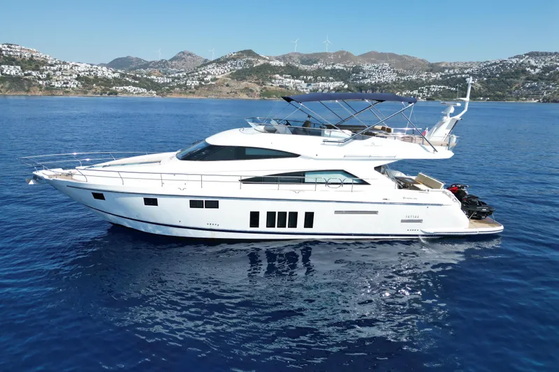  Yacht Photos Pics Luxury 2014 Fairline Squadron 65 yacht cruising on serene blue waters.