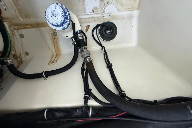  Yacht Photos Pics 2015 Hydra-Sports 3400 CC boat interior showing hoses and fittings.