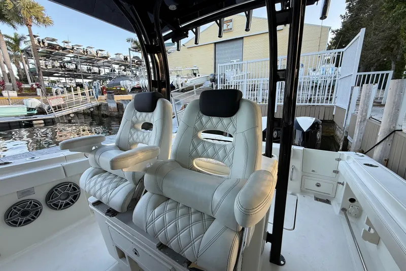  Yacht Photos Pics 2015 Hydra-Sports 3400 CC boat interior with luxurious seating at a marina.