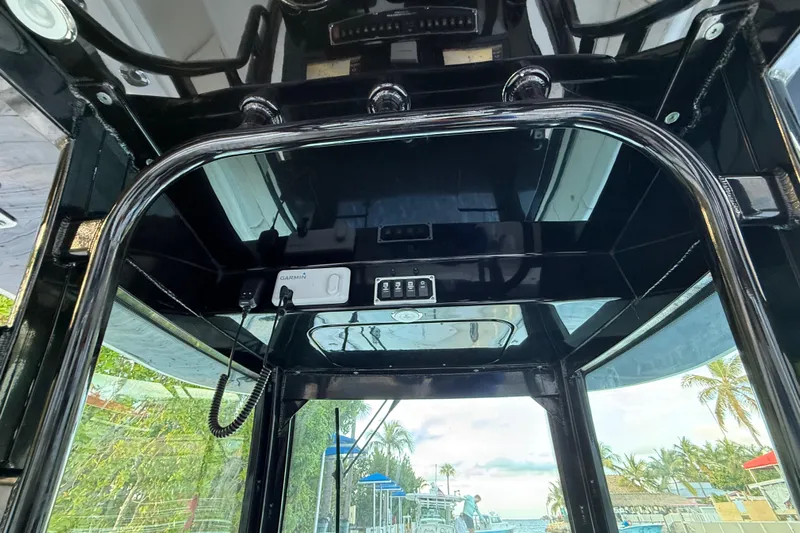  Yacht Photos Pics Interior view of 2015 Hydra-Sports 3400 CC boat with electronic controls and tropical background.