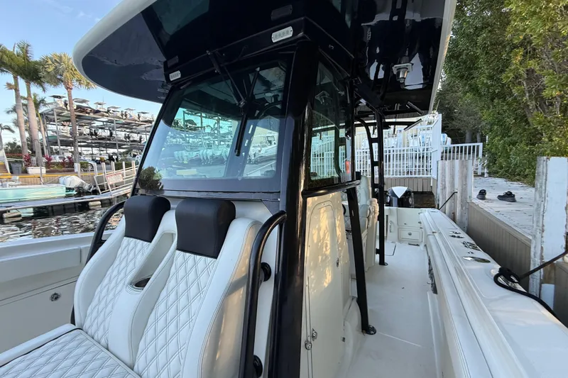  Yacht Photos Pics 2015 Hydra-Sports 3400 CC boat with luxurious seating at a marina dock.