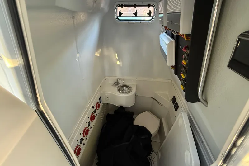  Yacht Photos Pics 2015 Hydra-Sports 3400 CC boat interior with sink, toilet, and control panel.