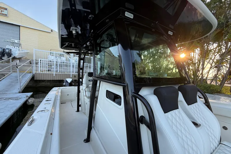  Yacht Photos Pics 2015 Hydra-Sports 3400 CC boat docked, featuring sleek design and comfortable seating.