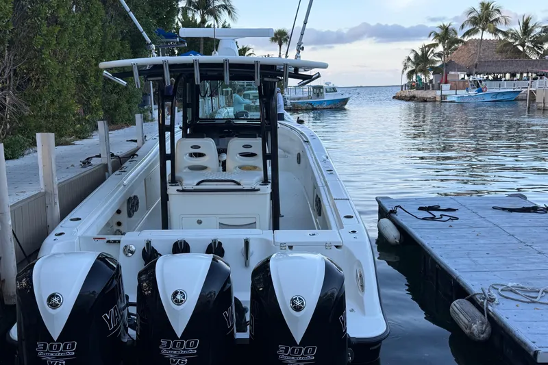 Yacht Photos Pics 2015 Hydra-Sports 3400 CC boat docked by a scenic waterfront.