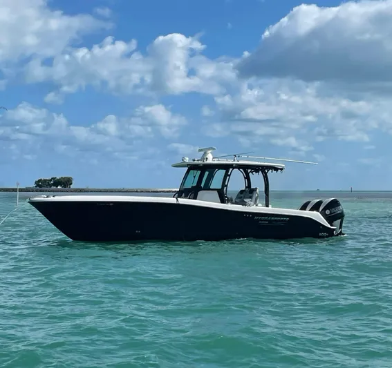  Yacht Photos Pics 2015 Hydra-Sports 3400 Center Console boat on calm ocean waters under blue sky.