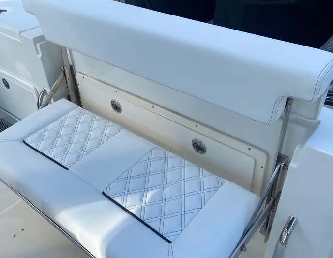  Yacht Photos Pics 2015 Hydra-Sports 3400 Center Console boat seat with white cushioned upholstery.