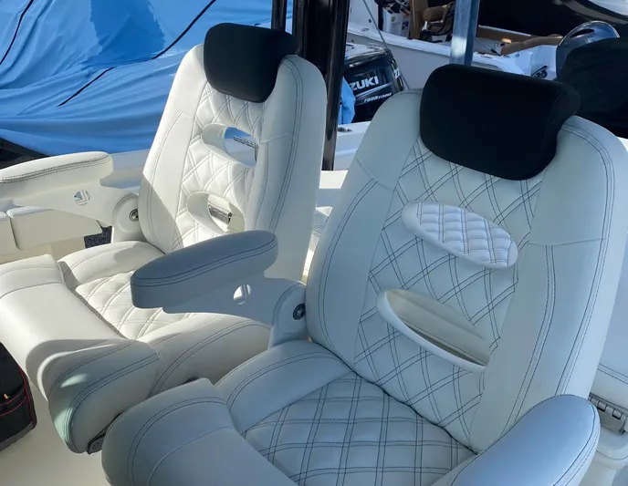  Yacht Photos Pics Luxurious seating on a 2015 Hydra-Sports 3400 Center Console boat, featuring quilted upholstery.