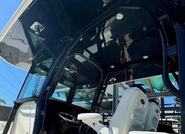  Yacht Photos Pics 2015 Hydra-Sports 3400 Center Console boat interior with sleek black design and white seating.