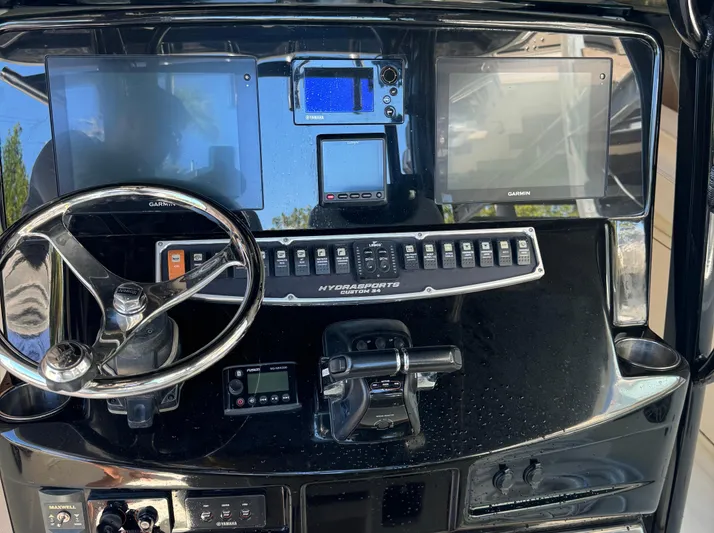  Yacht Photos Pics 2015 Hydra-Sports 3400 Center Console dashboard with Garmin displays and steering wheel.