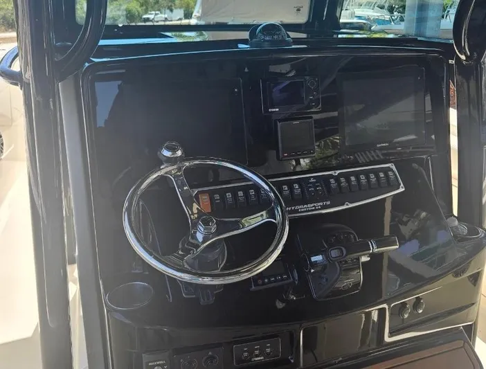  Yacht Photos Pics 2015 Hydra-Sports 3400 Center Console dashboard with steering wheel and navigation controls.