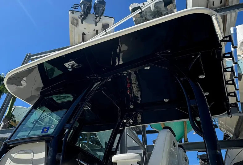  Yacht Photos Pics 2015 Hydra-Sports 3400 Center Console boat with T-top, viewed from below against blue sky.