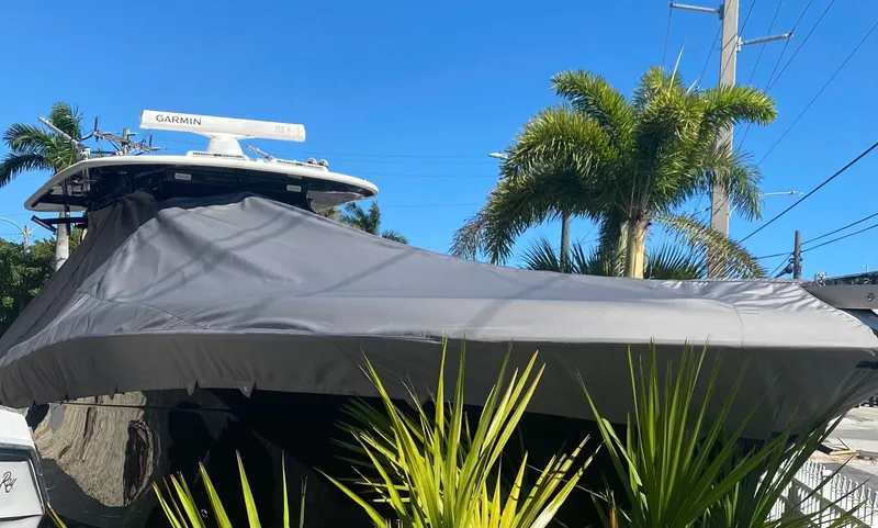  Yacht Photos Pics 2015 Hydra-Sports 3400 Center Console boat with cover, palm trees in background.