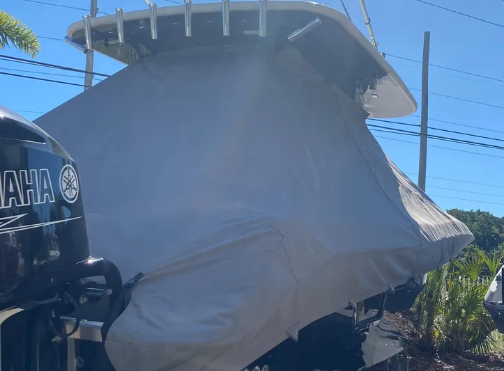  Yacht Photos Pics 2015 Hydra-Sports 3400 Center Console boat covered, with Yamaha outboard motor visible.