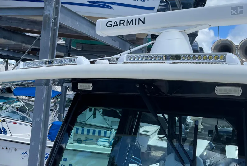  Yacht Photos Pics 2015 Hydra-Sports 3400 Center Console with Garmin equipment and LED lights in a marina.