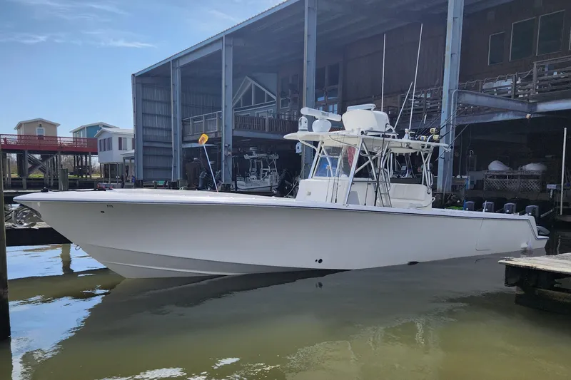  Yacht Photos Pics 2019 SeaVee 390Z boat docked in marina, side view, under clear blue sky.