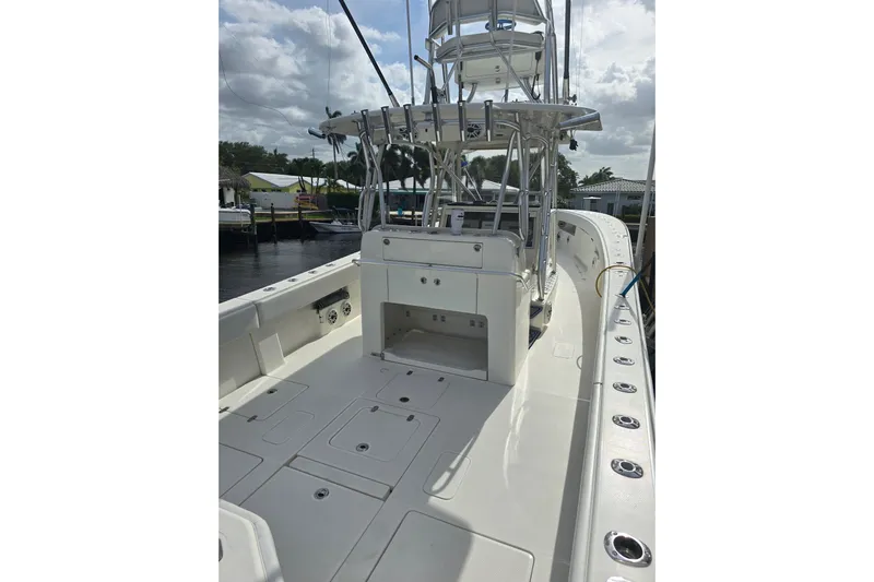 Yacht Photos Pics 2019 SeaVee 390Z boat deck with fishing rod holders and storage compartments.